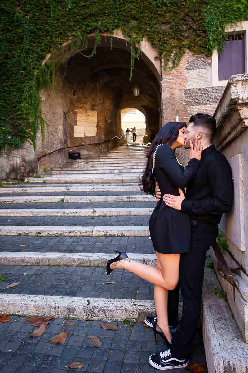 Couple kissing bottom Borgia staircase photography session
