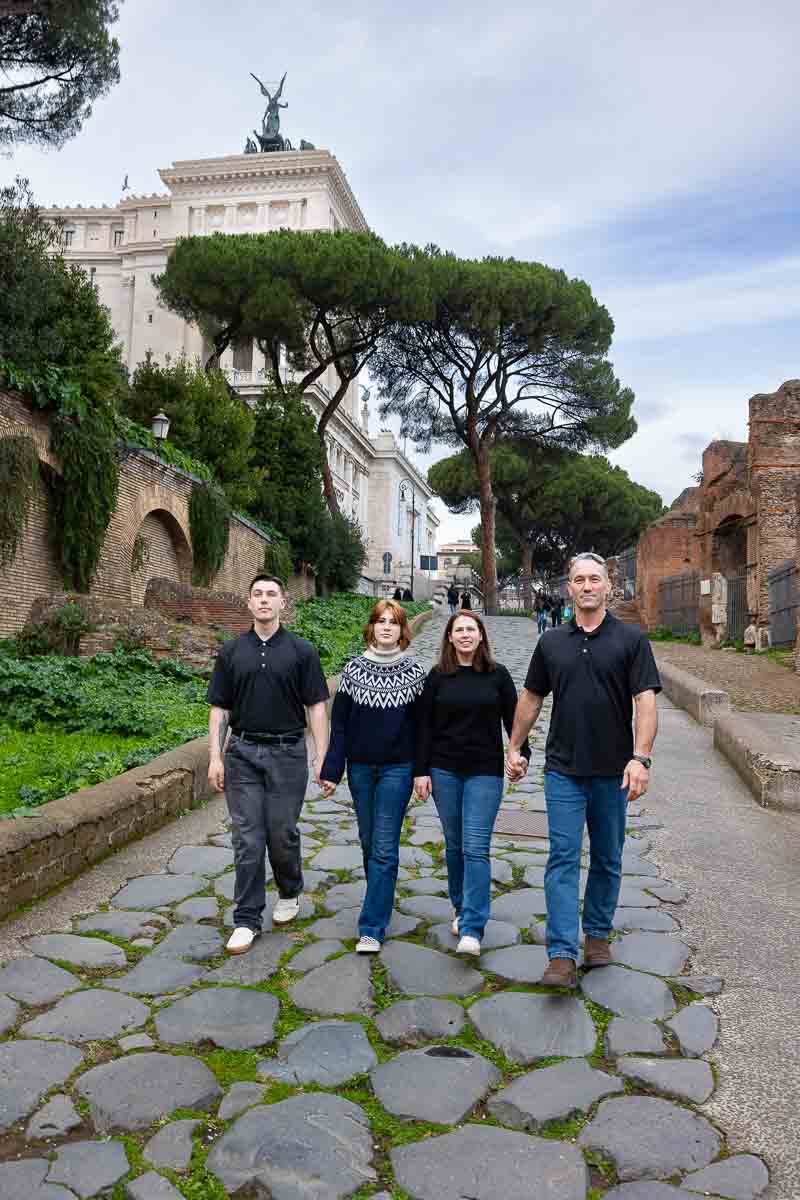 Walking together during a photoshoot stepping on ancient roman road