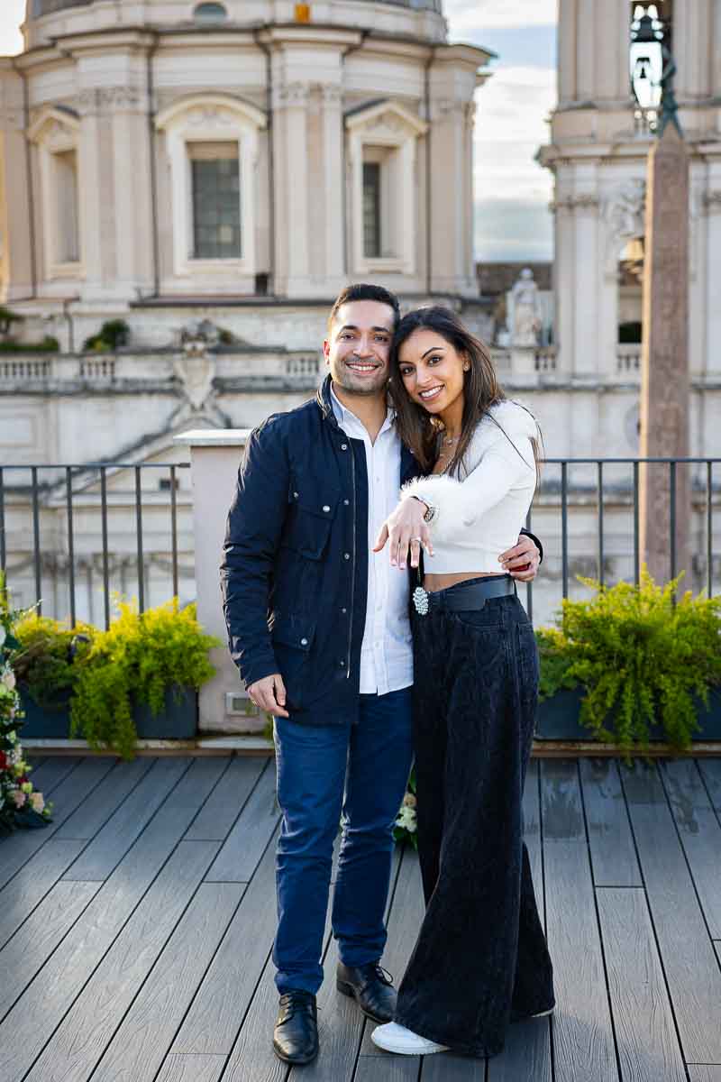 Just engaged and posing in front of the camera showing off the engagement ring 