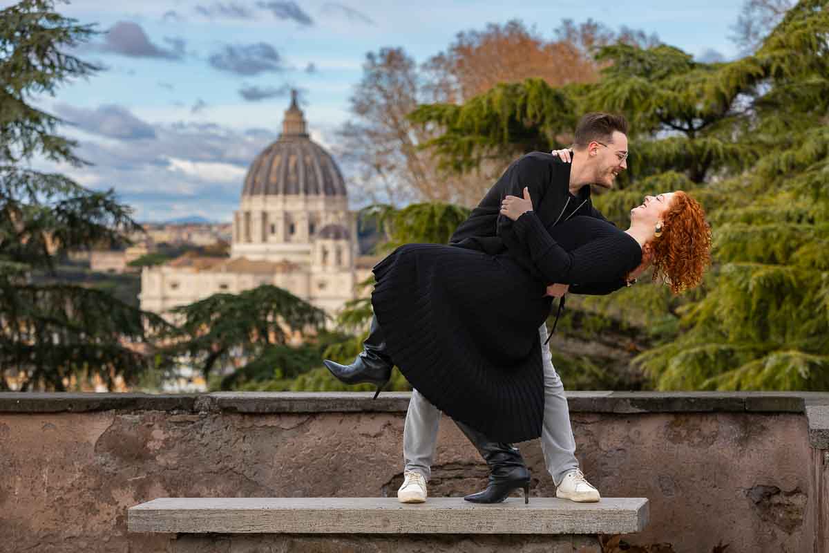 Singular couple pictures in front of the Vatican dome
