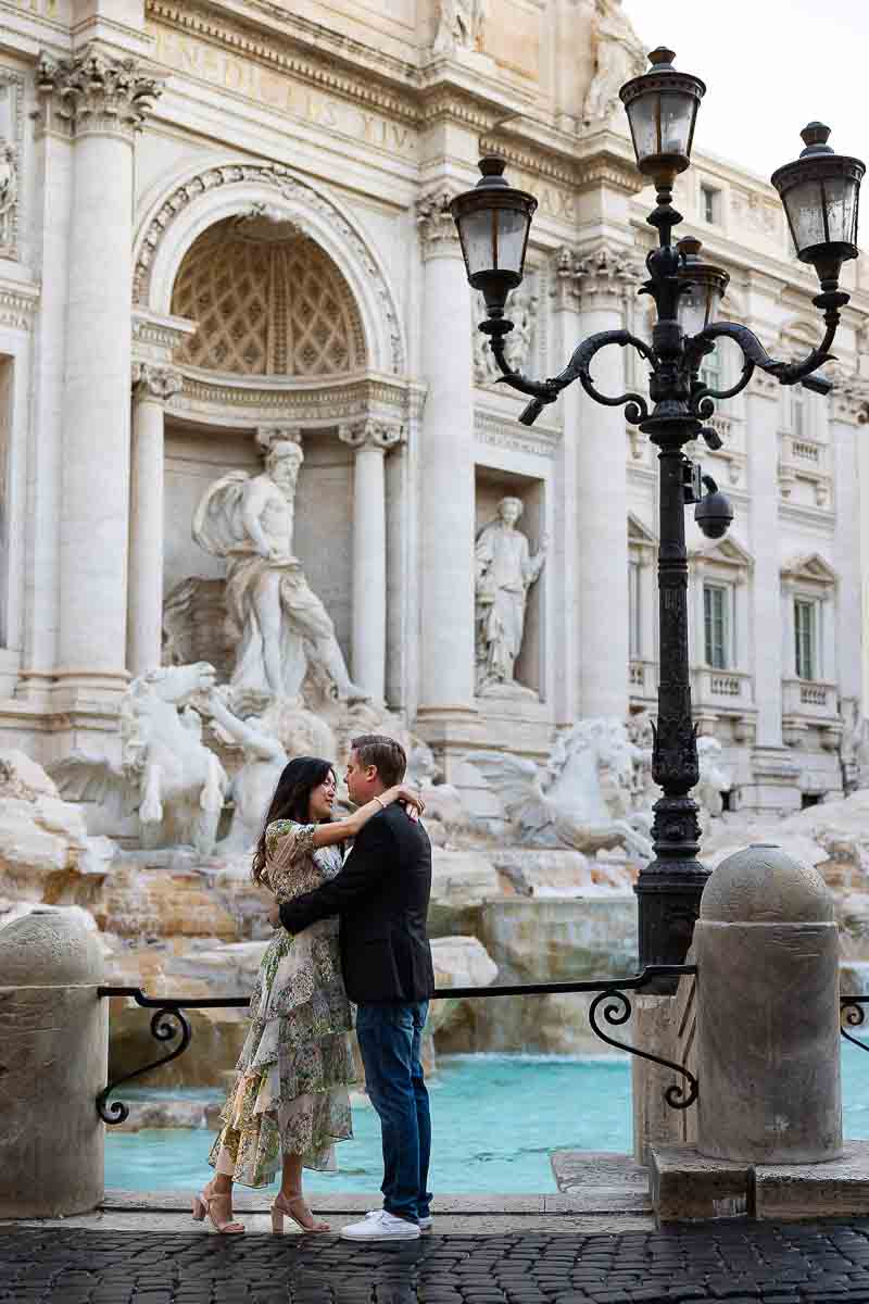 Sunrise engagement photoshoot in Rome early morning at the Trevi fountain