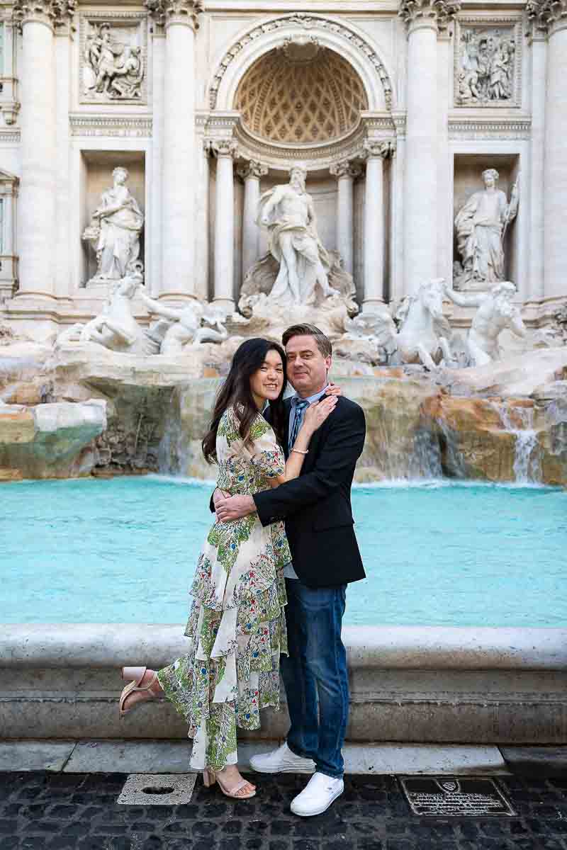 Just engaged in front of the Trevi fountain in the early morning light