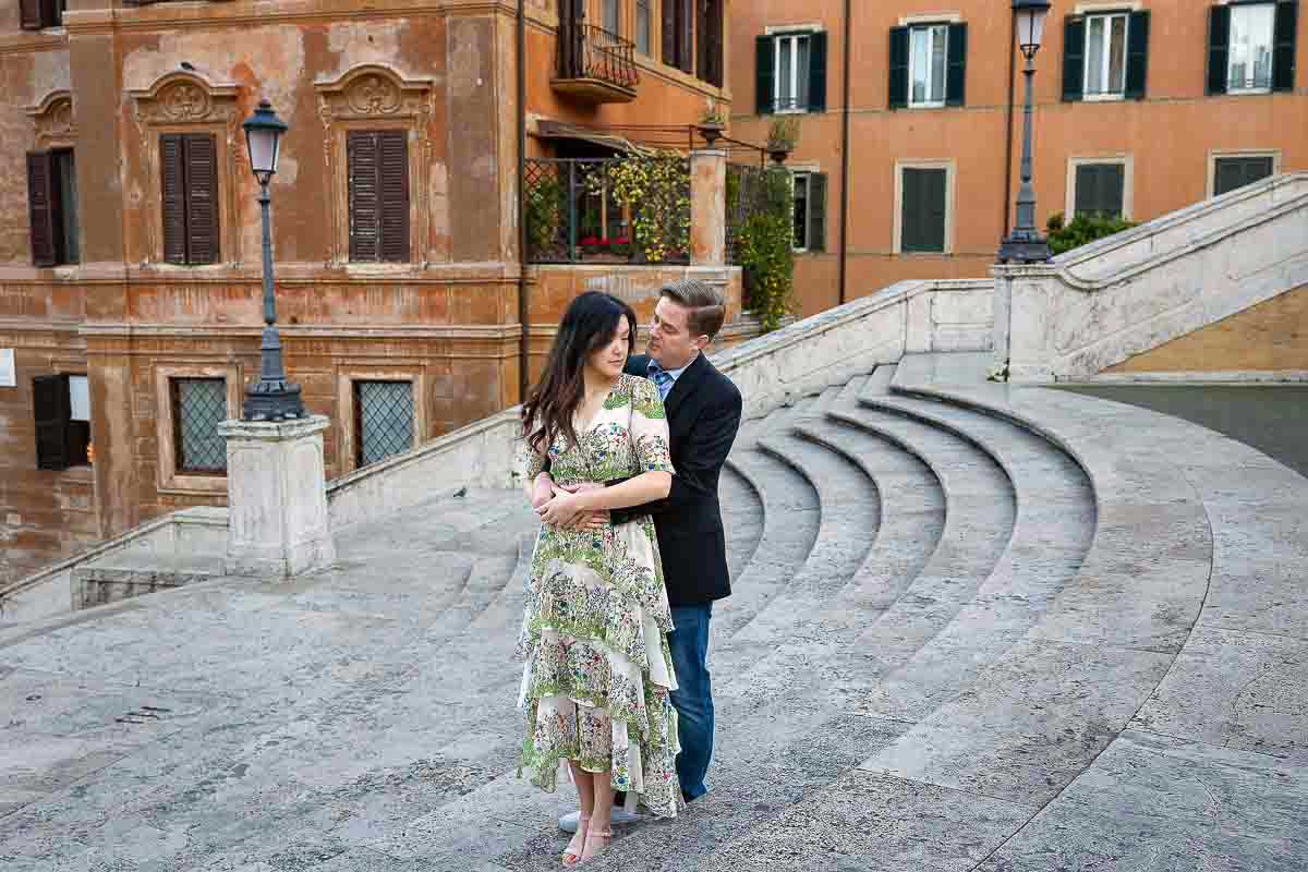 Posed on the Spanish steps holding together during a Rome photographer session