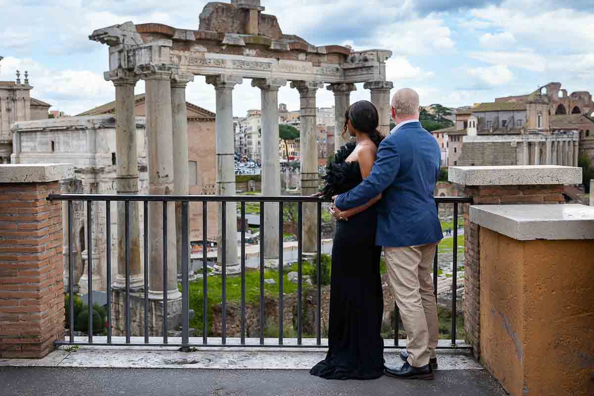 Admiring the view of the roman forum columns from a distance while on a photographer session in Rome Italy