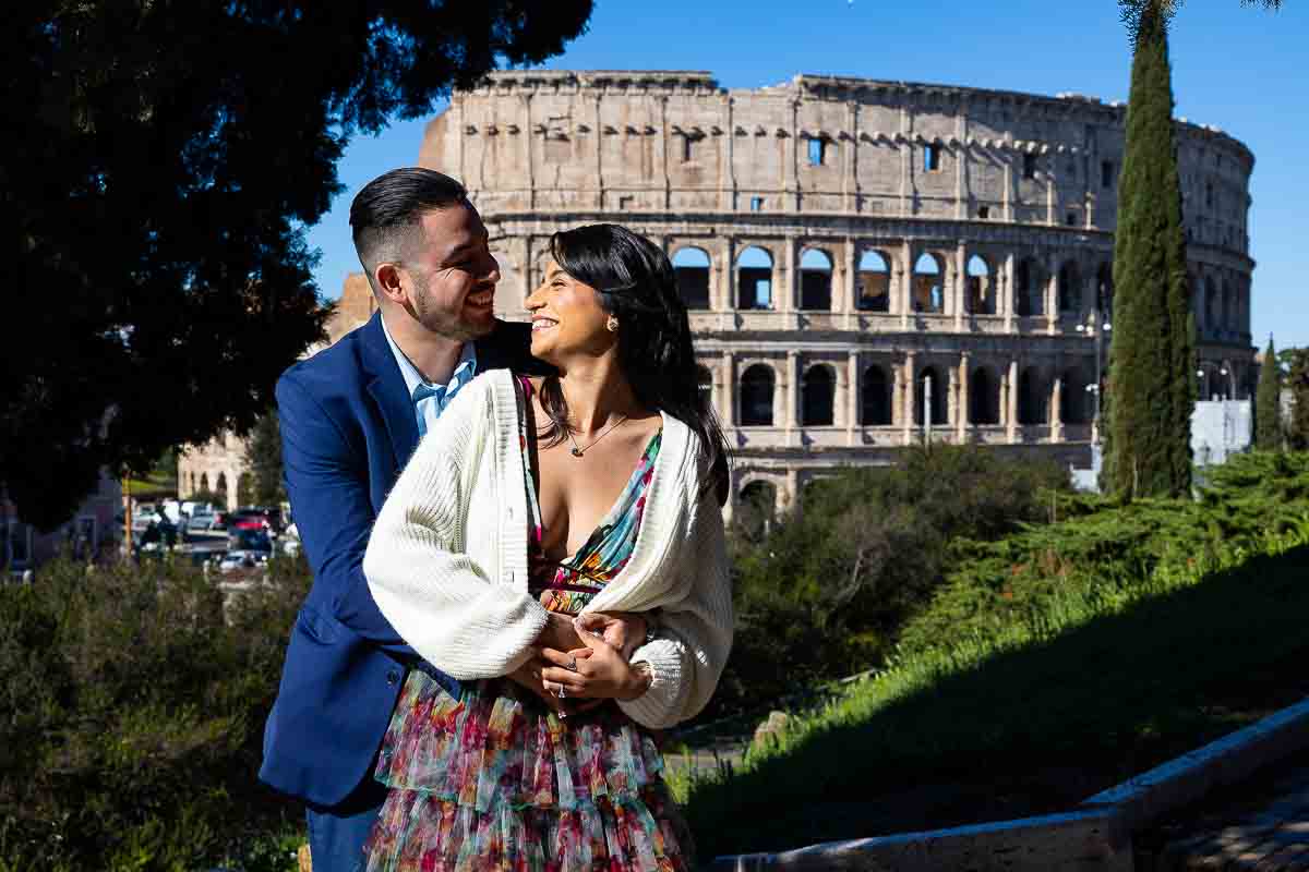 Couple portrait picture taken in front Roman Colosseum on a nice bright sunny morning