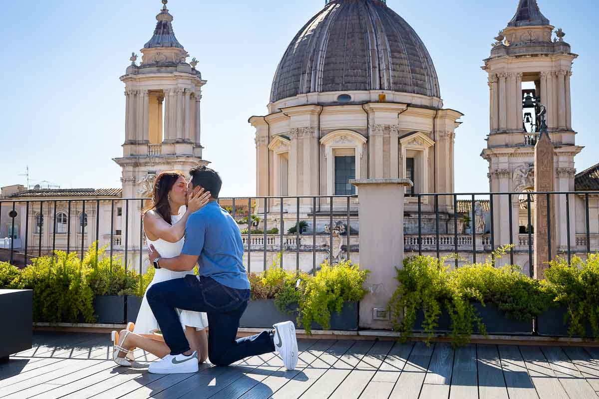 Both couple kneeling down with acceptance with a wonderful yes to the surprised proposal in Rome