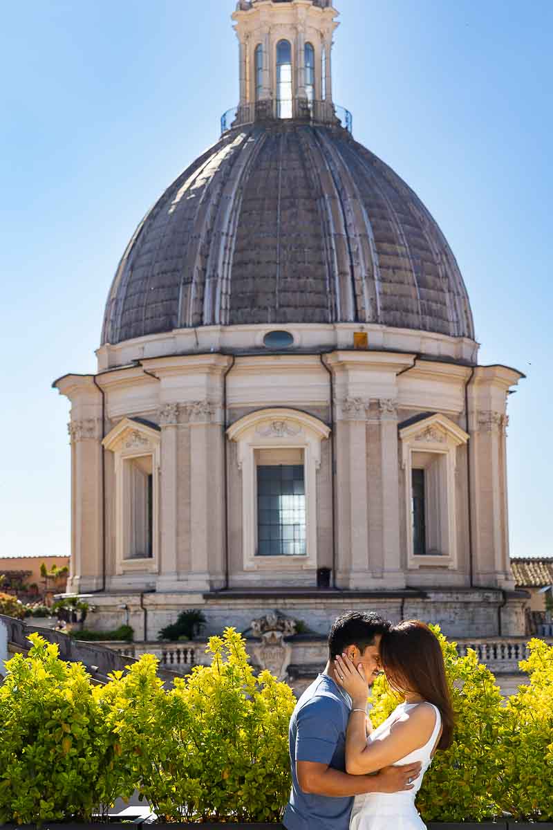 Artistic photography of a couple together in front of a church dome 