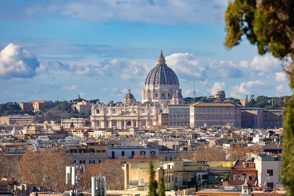 The view of Saint Peter's cathedral dome photographed from the Pincio terrace outlook in Rome Italy