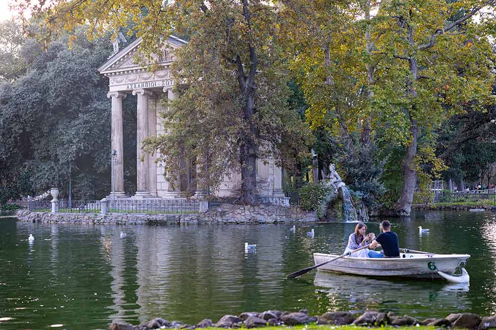 The Villa Borghese lake with a quiet boat floating on the water 