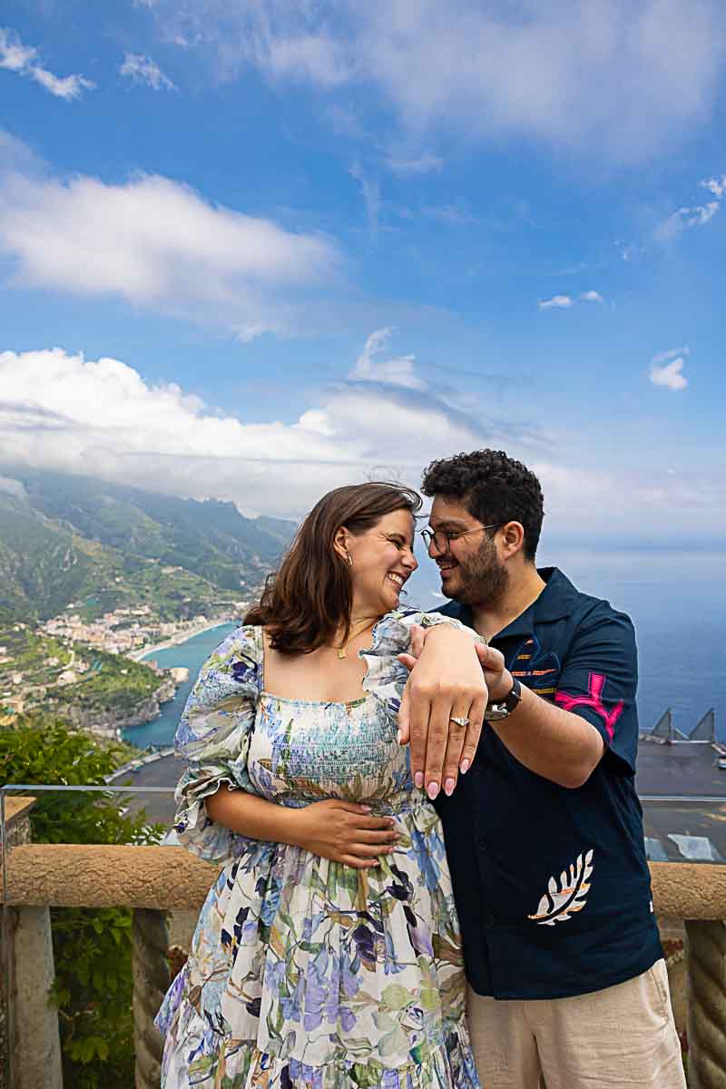 Engagement photo shoot of being together and showing the world their engagement ring
