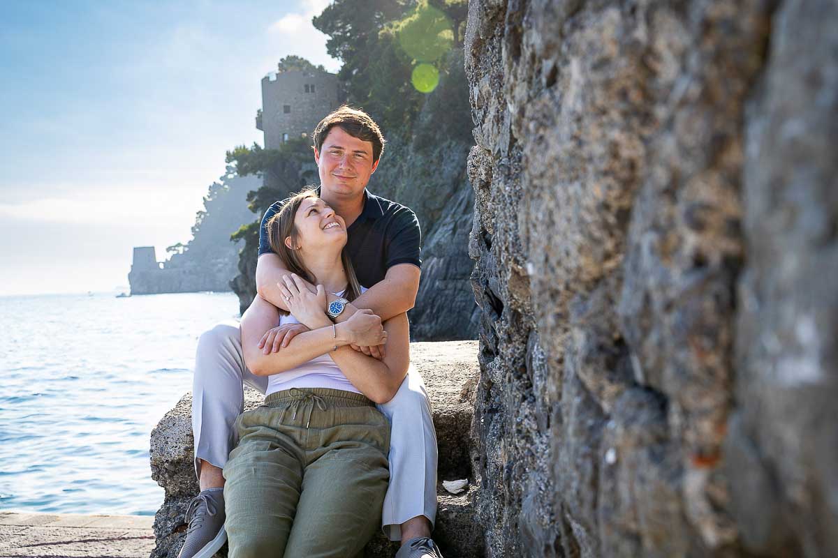 Portrait picture of a couple in love being posed during a photography session after a Private Terrace Proposal in Positano