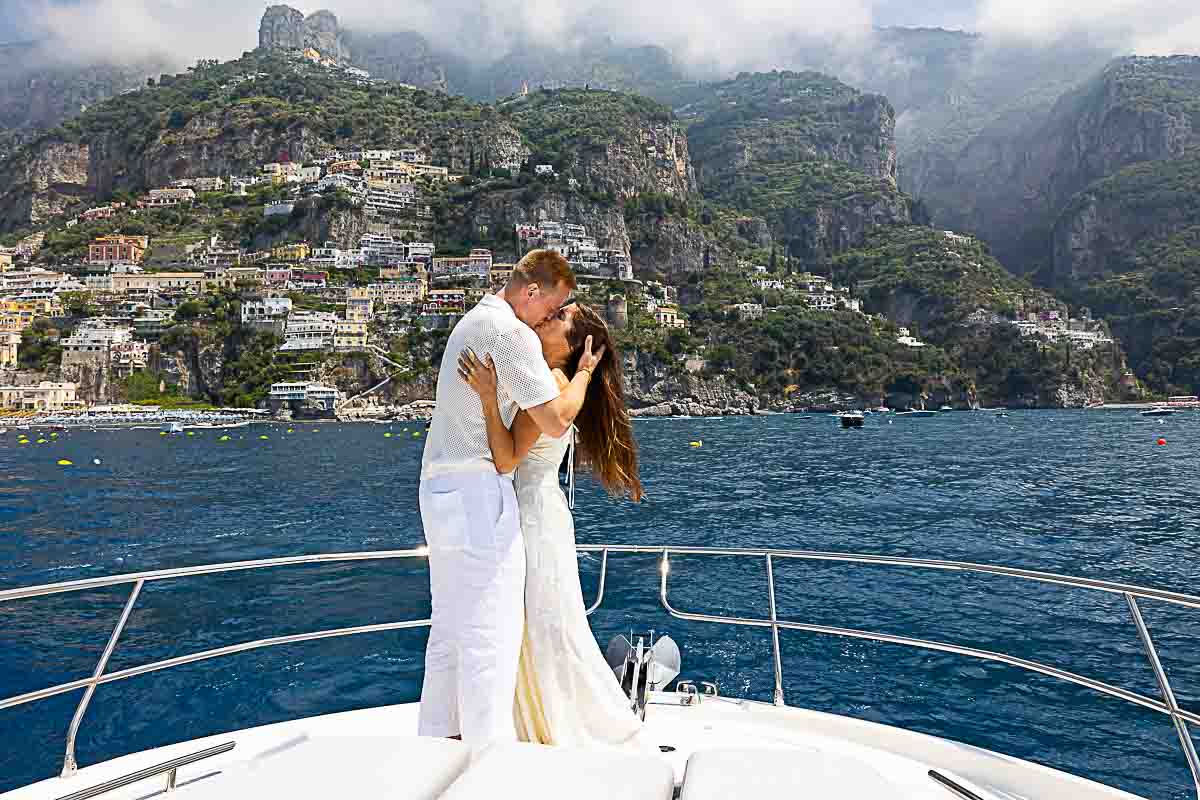 Just engaged and taking engagement photos on a boat over the sea with beautiful views