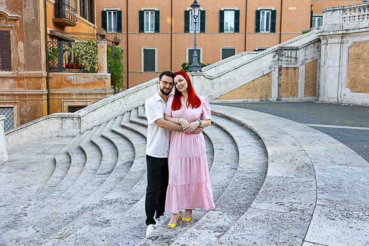 Candid engagement photo walking up the Spanish Steps during a sunrise photography session