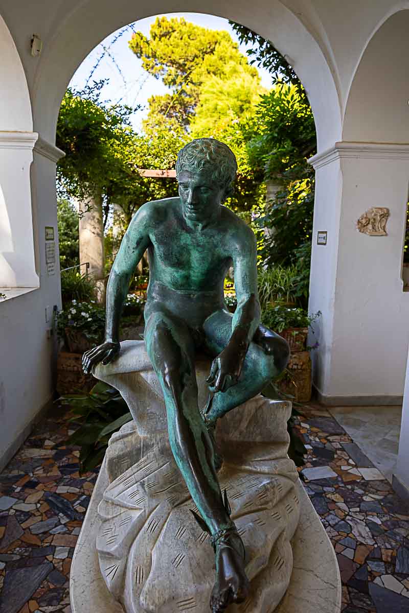 Interior shot of San Michele villa estate taking in consideration a statue under portico vertical shot