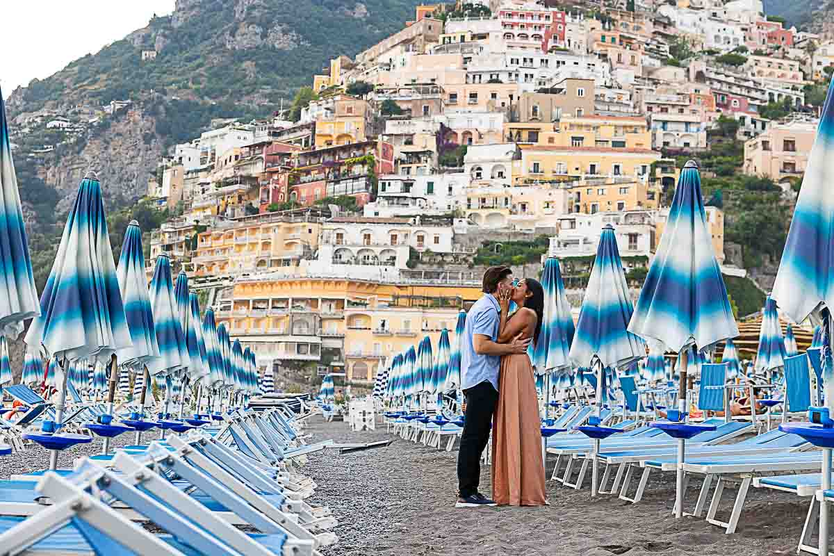 Just engaged on the beach at sunset in Spiaggia Grande after a surprise wedding marriage proposal in Positano 