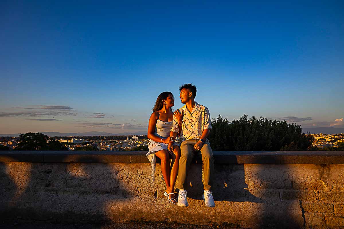 Couple posing under blue sky in the hour that counts photoshooting just engaged photos: Proposal at Sunset in Rome