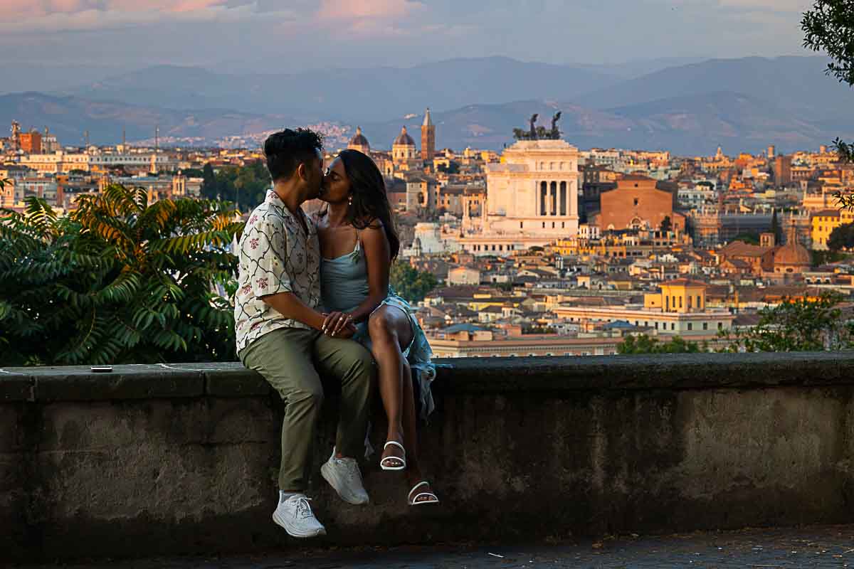 sitting down next to one another at dusk after sun had set behind the horizon being together while on a photography session with a professional photographer