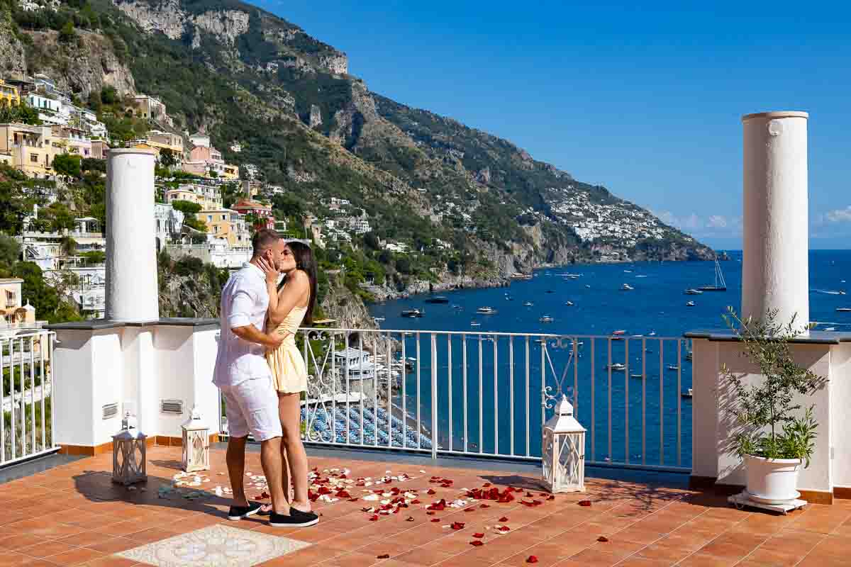 In love after a surprise wedding proposal candidly photographed by professional photographer and video recorded