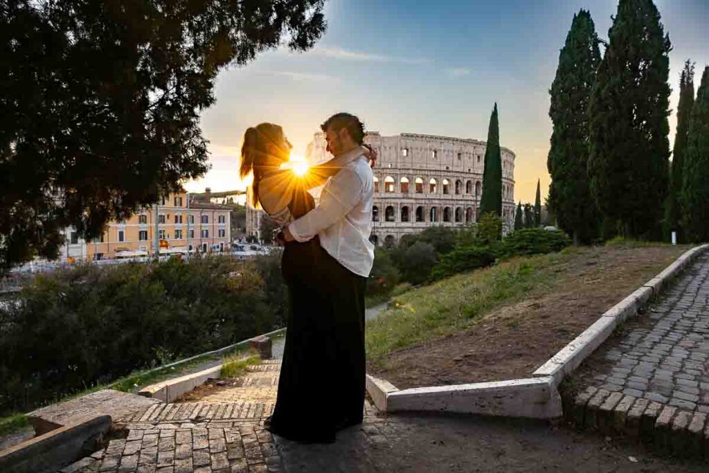 silhouette imagery at sunset in Rome during a proposal photoshoot at the roman Colosseum