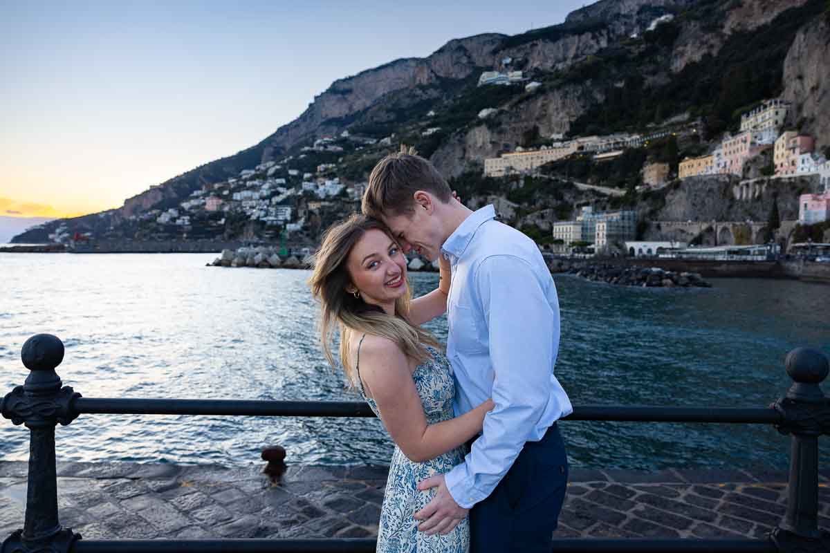 Posed during a photoshoot outdoor by the sea at sunset and sun down