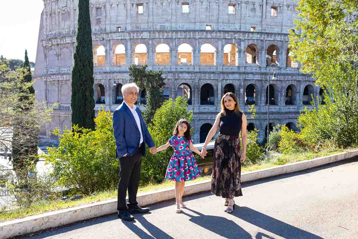 Standing together. Holding hands posing while looking into the photographic camera in Italy