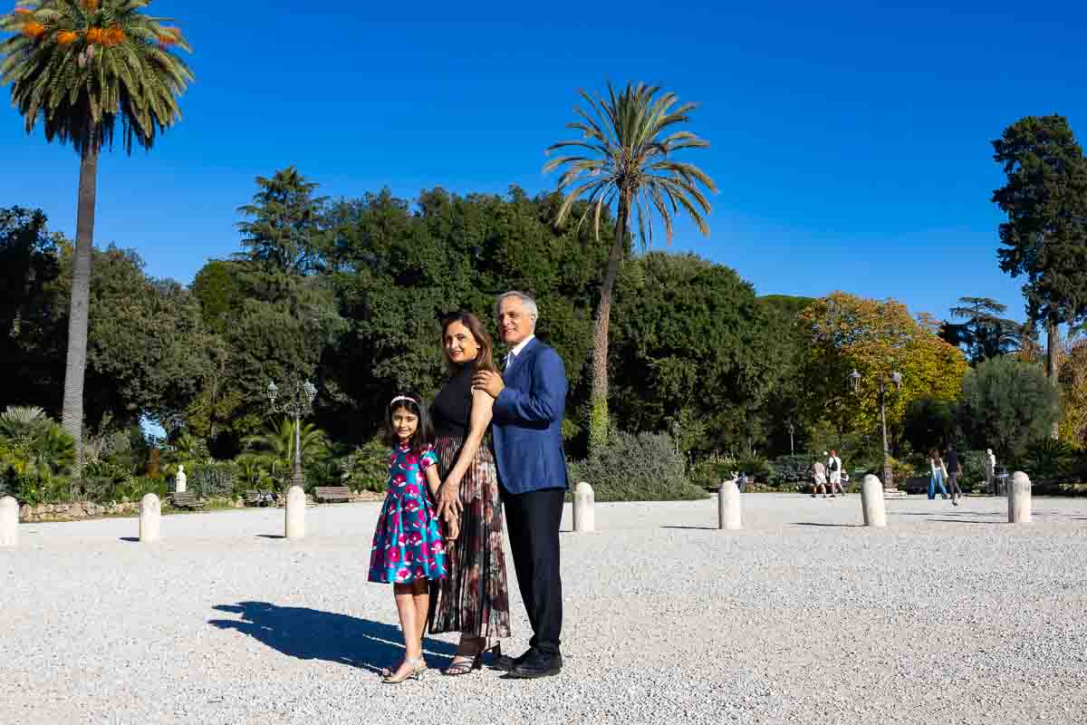 Final portrait photo standing under palm trees on the pincian hill