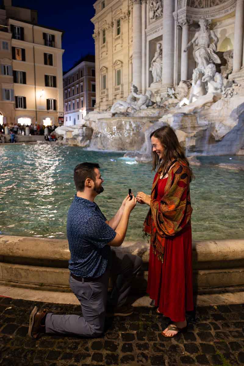 A surprise wedding proposal photographed during the knee down moment by a professional photographer from the Andrea Matone photography studio