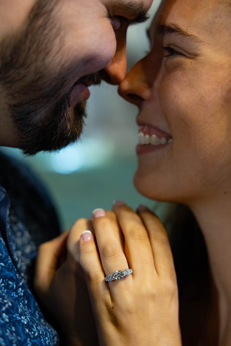 Closeup photo portrait nose to nose showing the ring that was used to get engaged