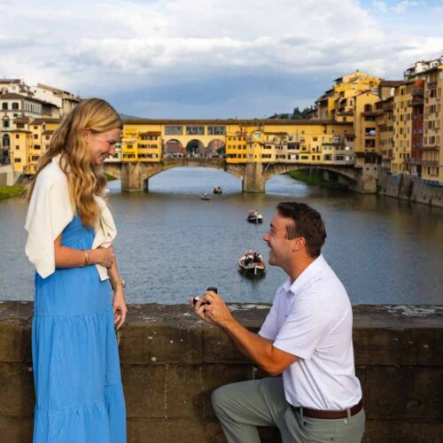 This is the proposal shot where he kneeled down to propose to her on one knee with a photographer from Florence taking pictures