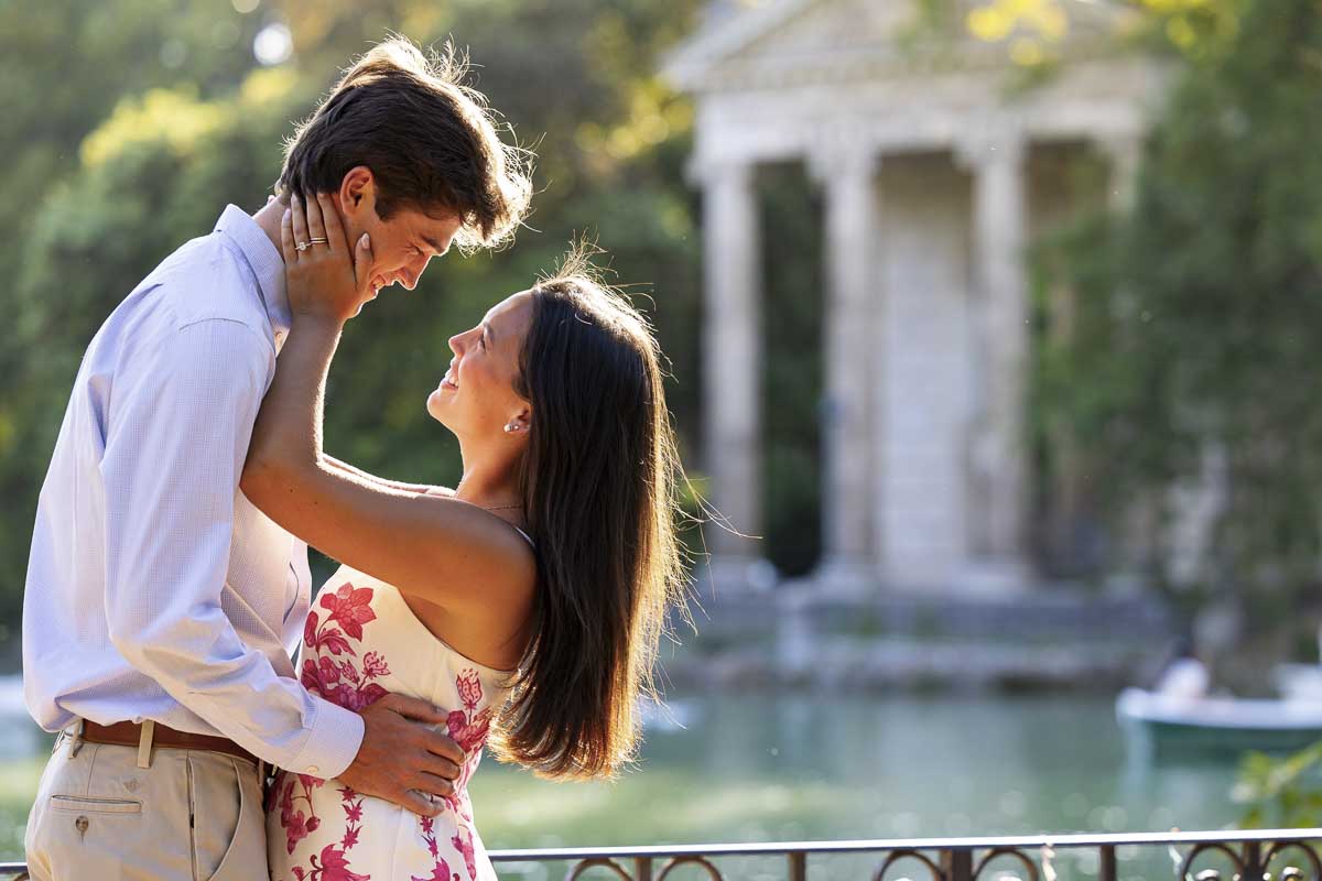 Kissed by the golden light sun as pictures are taken during an engagement photo session