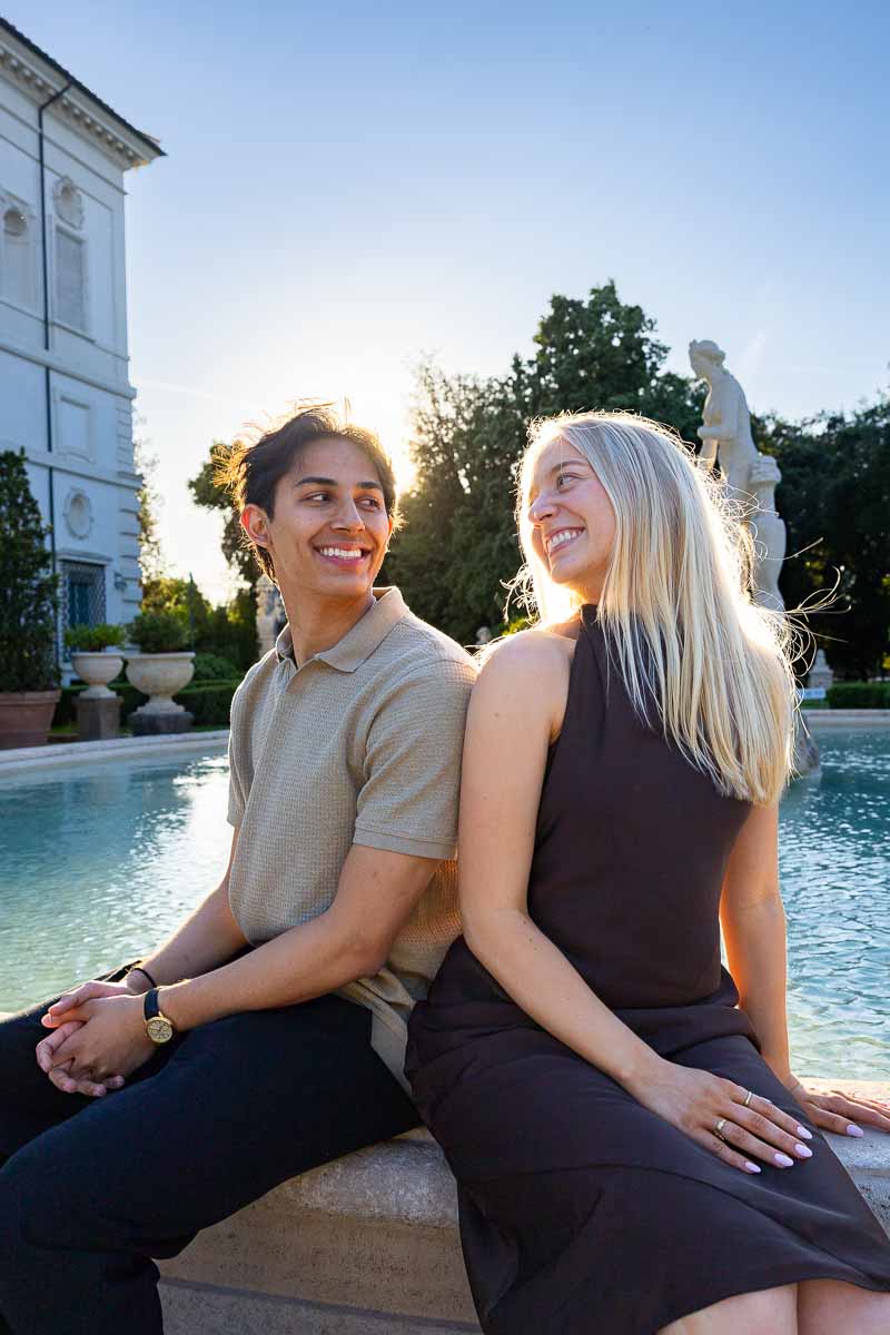 Sitting next to one another and looking at each other during golden hour dusk 