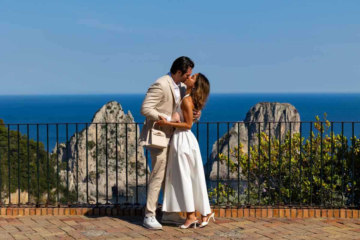 Taking pictures by the railing on a terrace with a stunning view