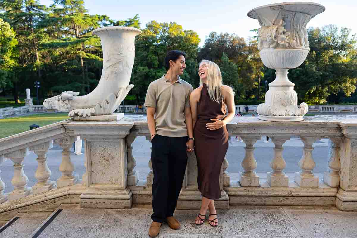 Standing portrait photo as they gaze into each other eyes after having been promised marriage 