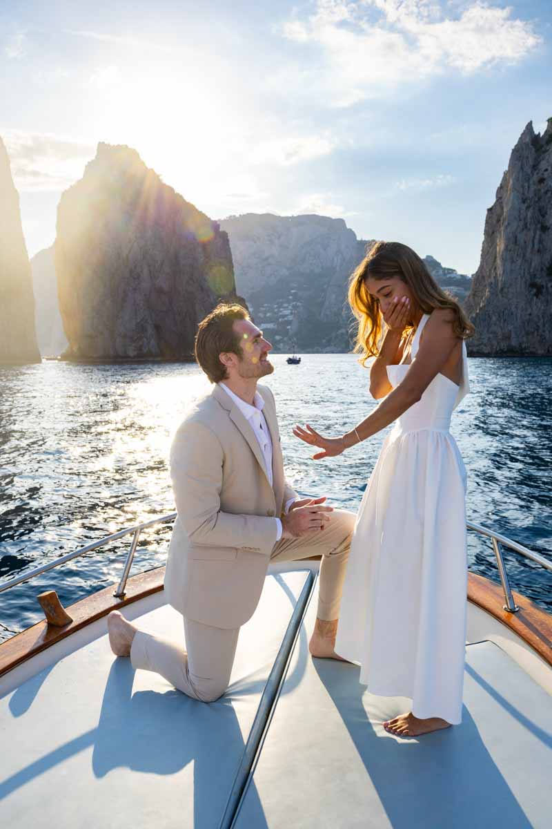 Looking at the diamond ring in ecstasy right after the proposing moment