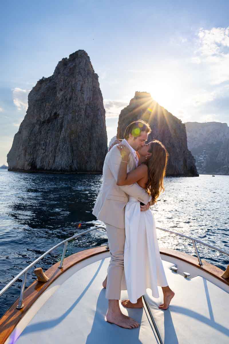In love other as newly engaged couple kissing at sunset