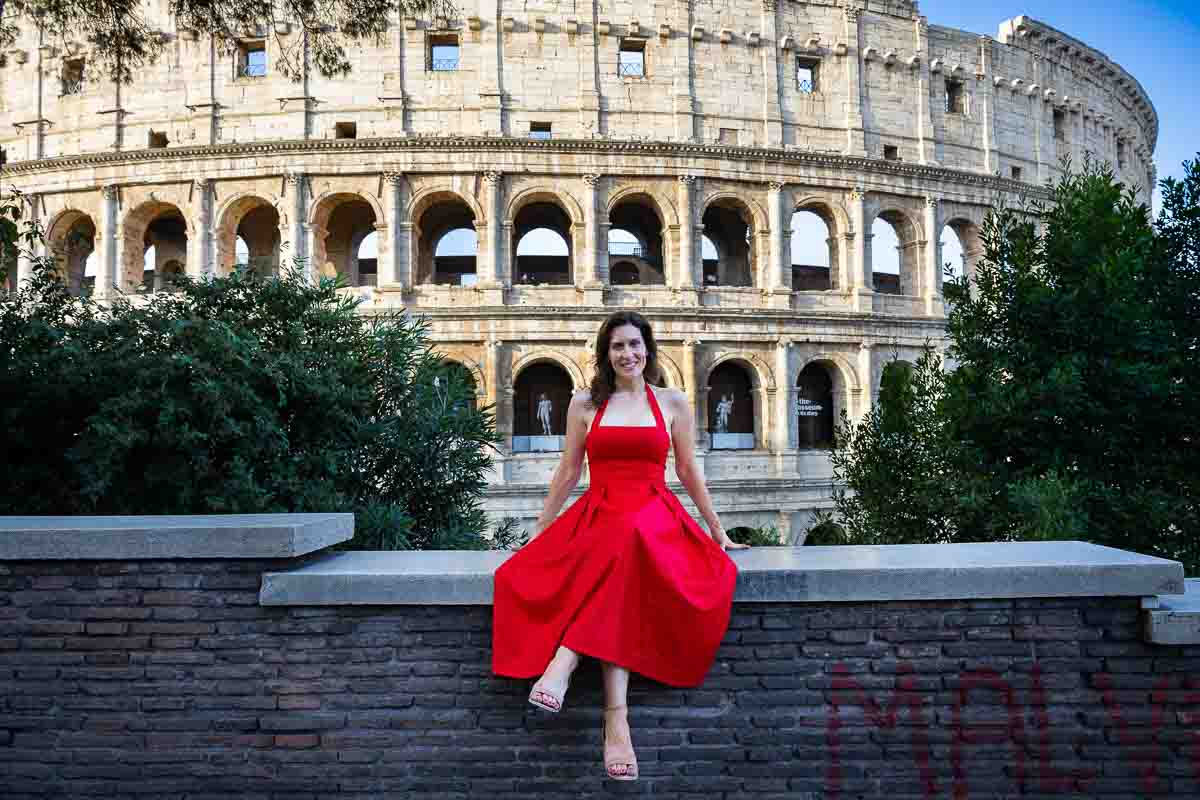 Classic Rome travel photograph featuring a woman posing in front of the ancient monument, combining personal portraiture with a timeless historic backdrop.