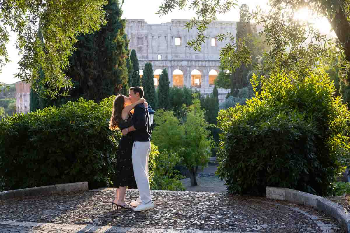 Kissing moment right after having proposed outside the Colosseum. Roma, Italy