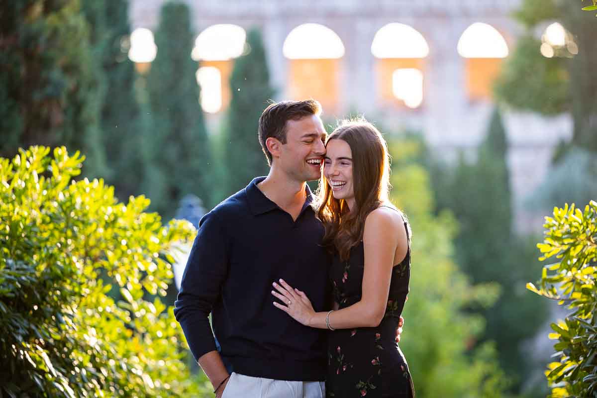 Portrait couple photography headshot bust upwards with the large monument and its arches in background