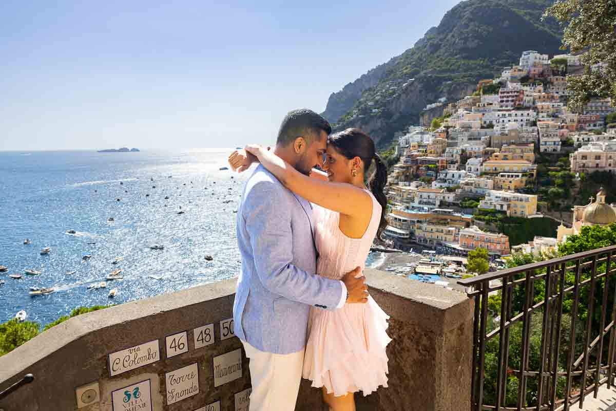 Environmental portraiture highlighting a romantic pair standing at a premier panoramic overlook.